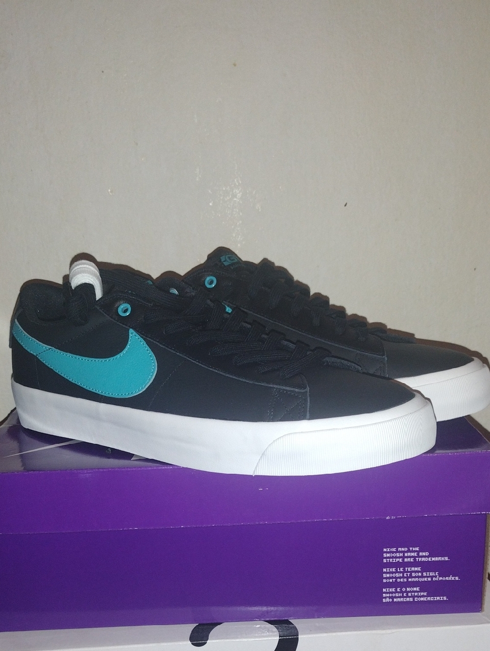 Nike Black Sneakers with Teal Swoosh and White Sole